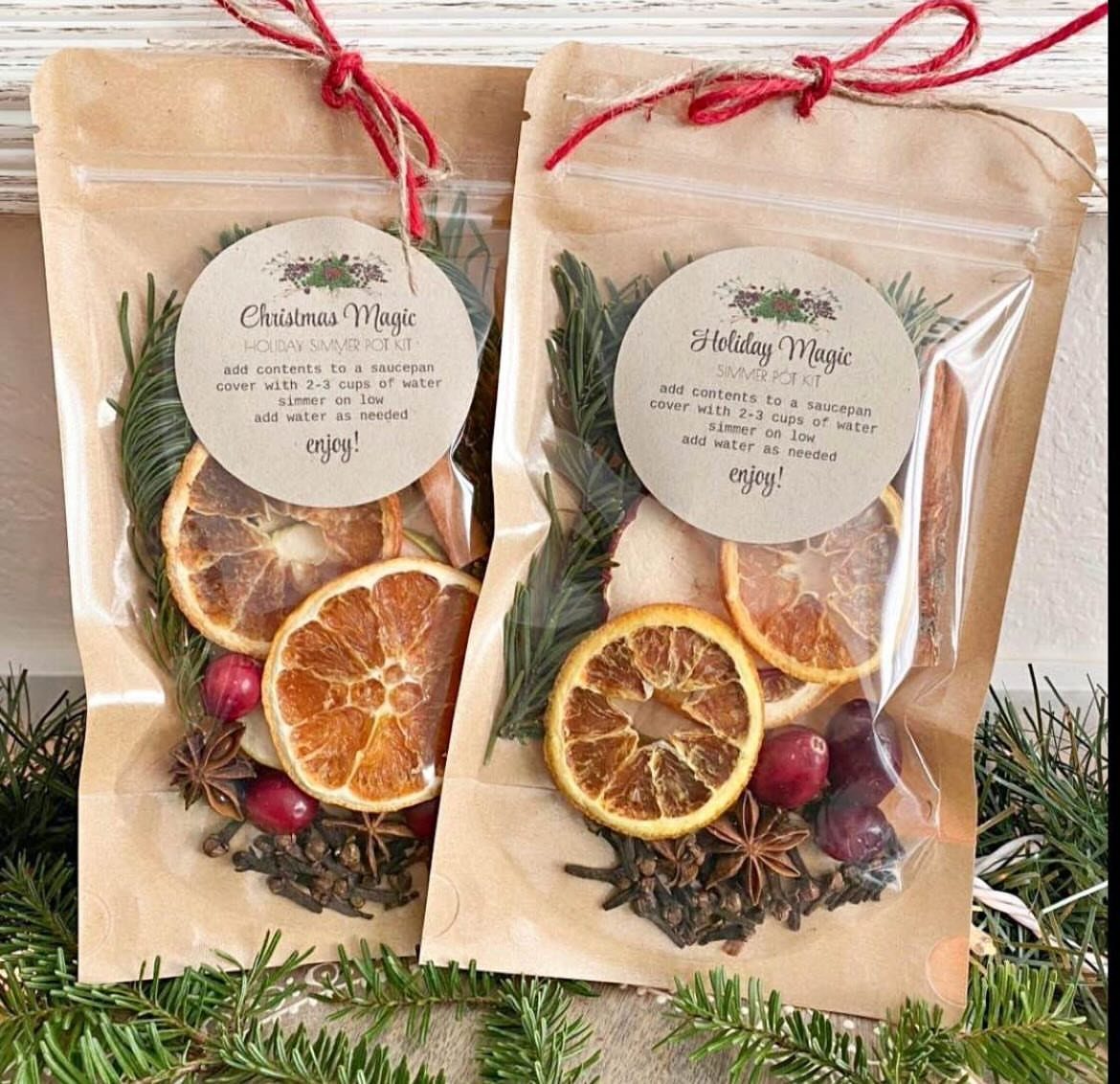 Two brown paper pouches filled with dried citrus and spices for holiday potpourri.