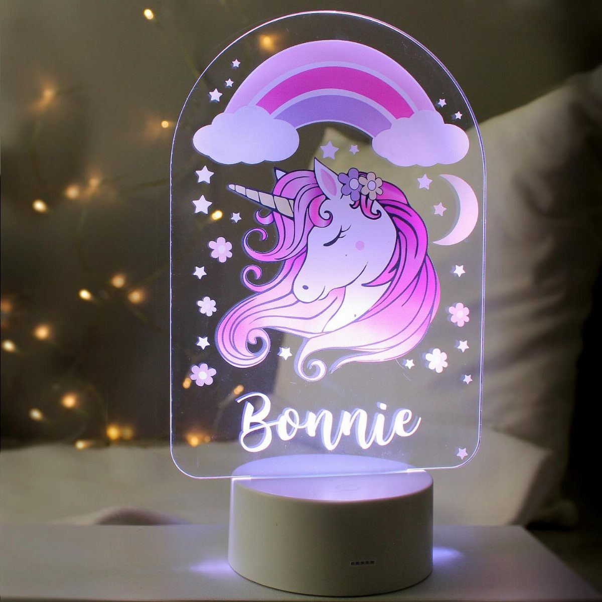 Glowing unicorn nightlight with rainbow and the name Bonnie on a white base.