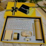 Gold birthday gift set with keyboard and accessories in a yellow box