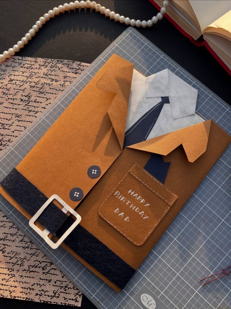 Handmade birthday card for dad shaped like a brown suit with a tie.