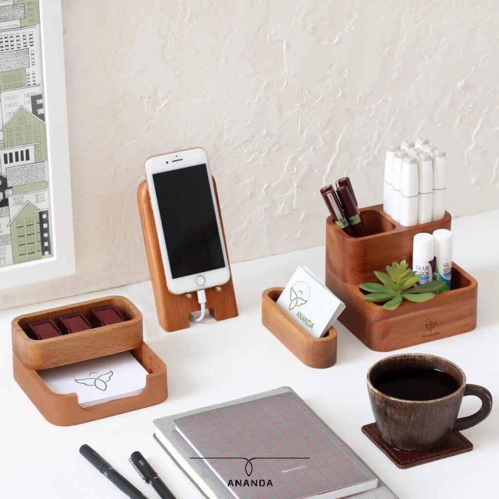 Wooden desk organizer set with phone stand, pen holder, and coffee cup.